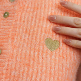 ÄRMELLOSE STRICKWESTE MIT HERZCHEN