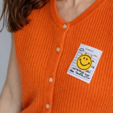 ORANGENE STRICKWESTE "SMILEY"