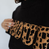 SCHWARZER PULLOVER „AMOUR"